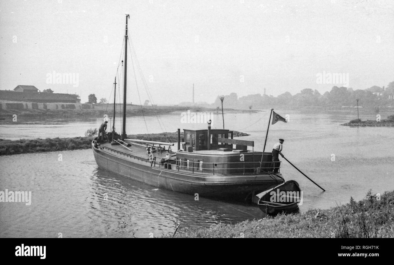 Rhine River, a barge leaves its berth at Arnhem 1937 Stock Photo