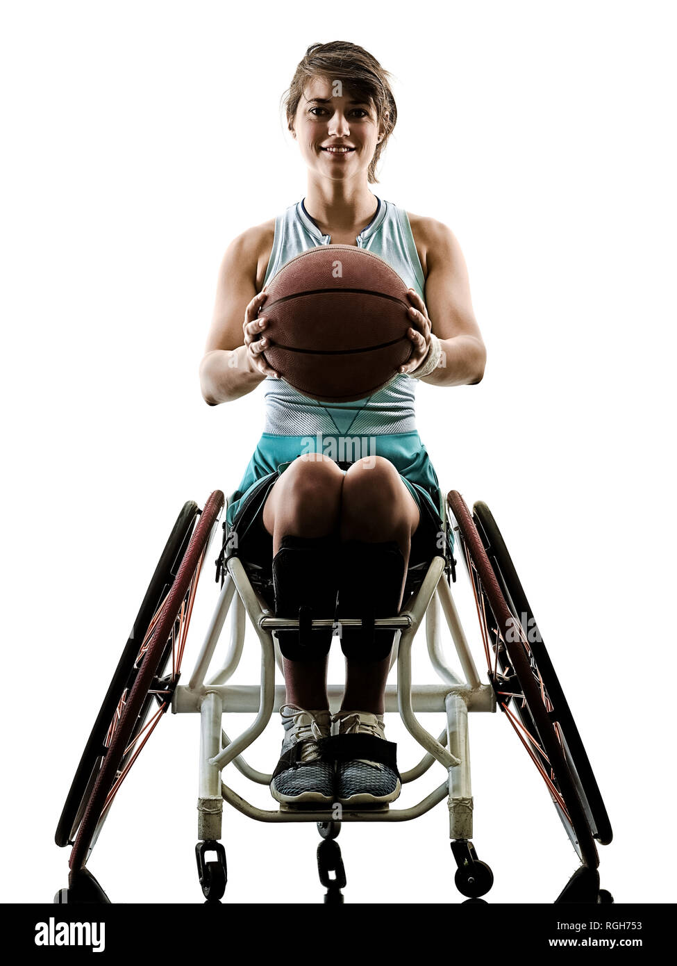 one caucasian young handicapped basket ball player woman in wheelchair sport  tudio in silhouette isolated on white background Stock Photo
