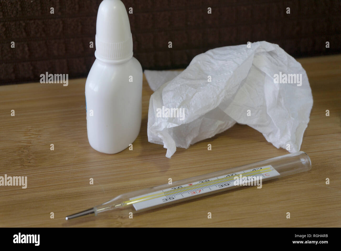 Medical mercury thermometer, nasal spray and napkins. Medicine