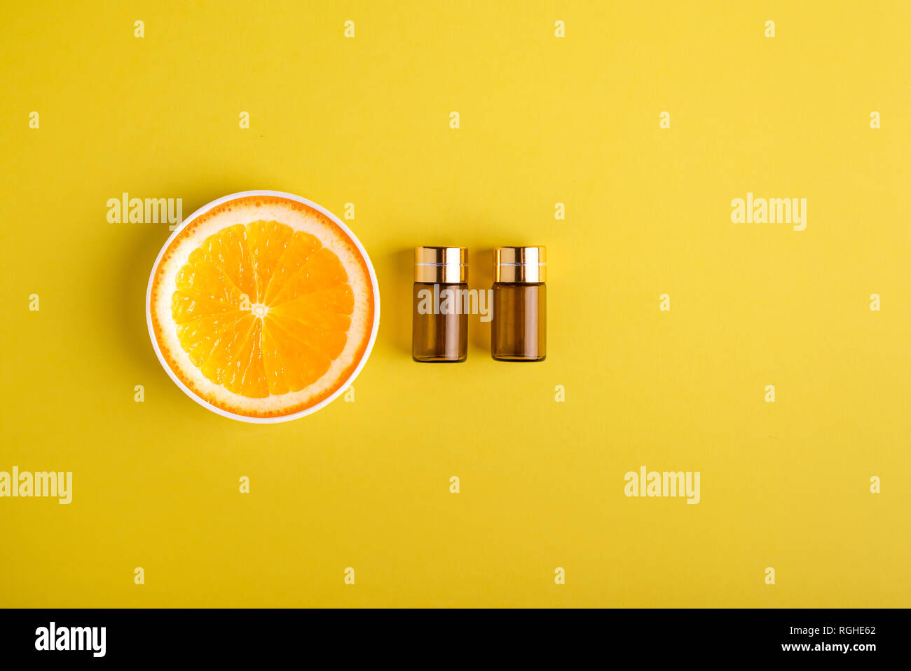 Serum and cosmetics with vitamin C. Essential oil from citrus fruits. Stock Photo