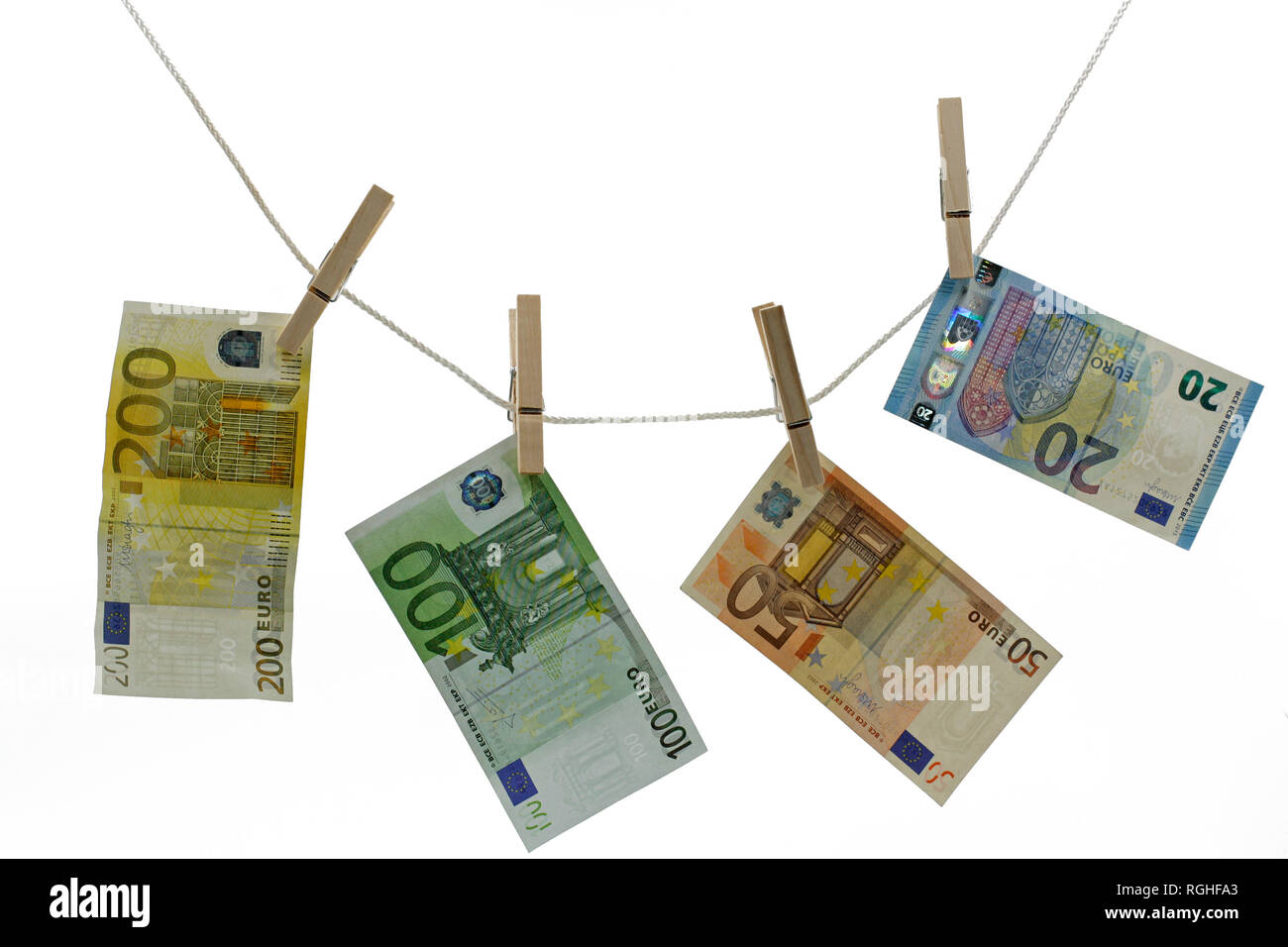 money, euros on clothes line with clip isolated on white Stock Photo