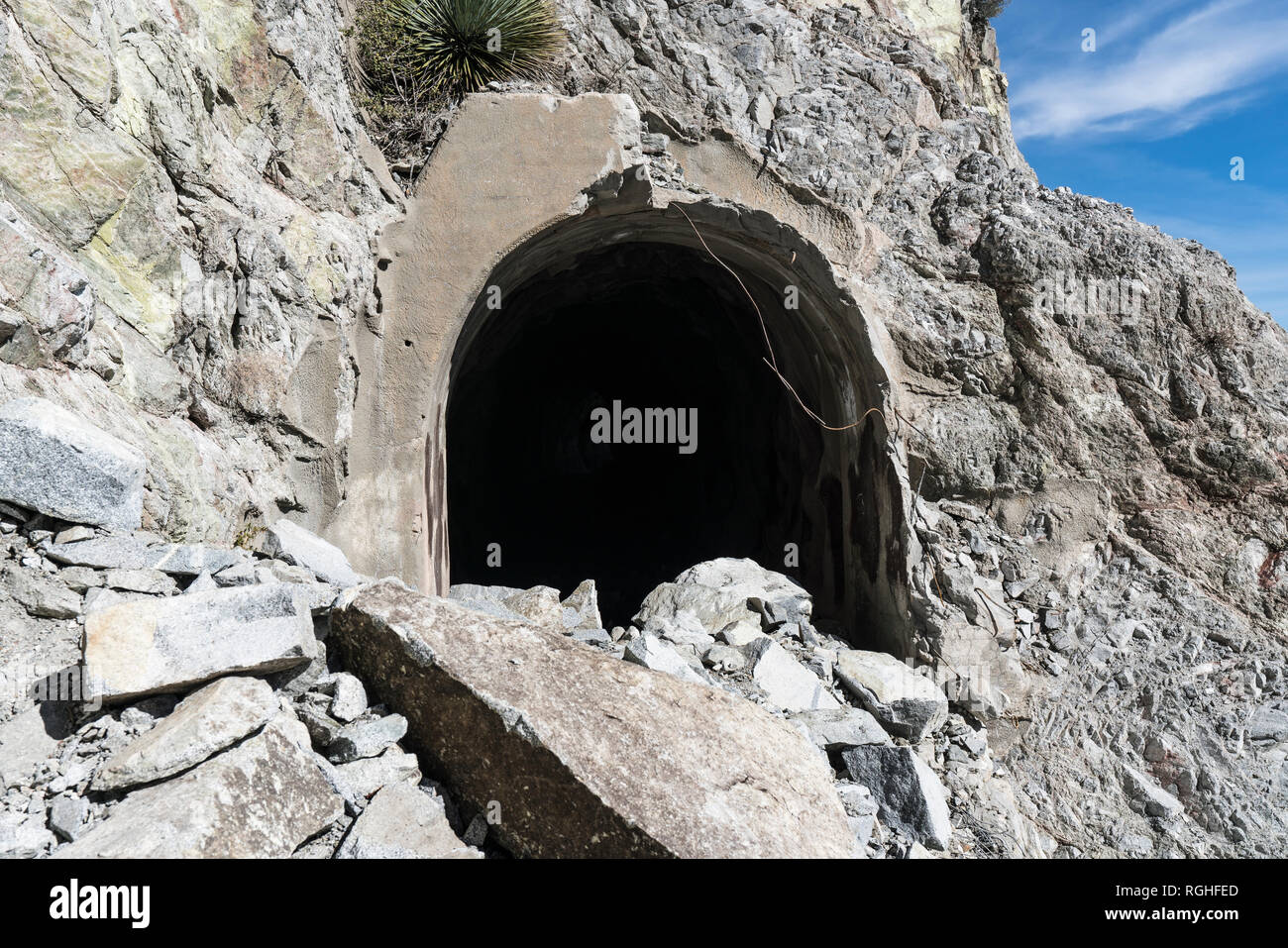Partially collapsed entrance and rock slide damage at Mueller Tunnel in the San Gabriel Mountains and Angeles National Forest above Los Angeles, Calif Stock Photo