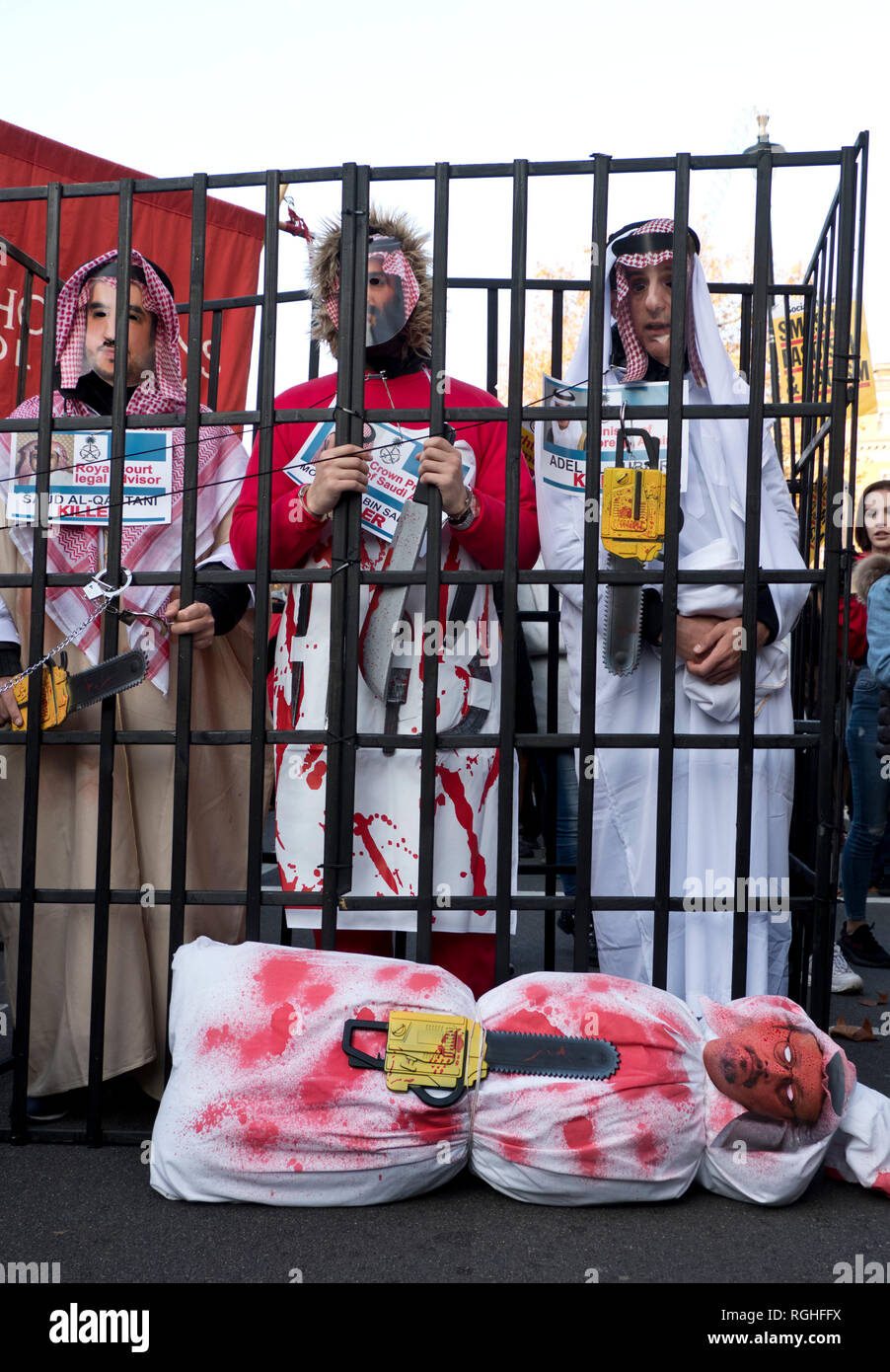 Following killing US Saudi journalist Jamal Khashoggi in Turkey, demonstrators came dressed as Saudi officials, including Saudi Crown Prince Mohammad bin Salman, inside a fake prison cell . Stock Photo