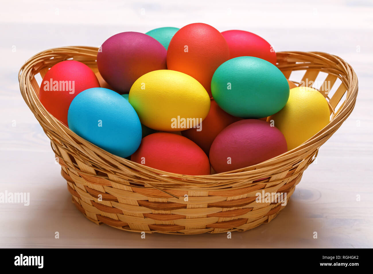 Many Easter colored eggs in the basket. Close-up Stock Photo