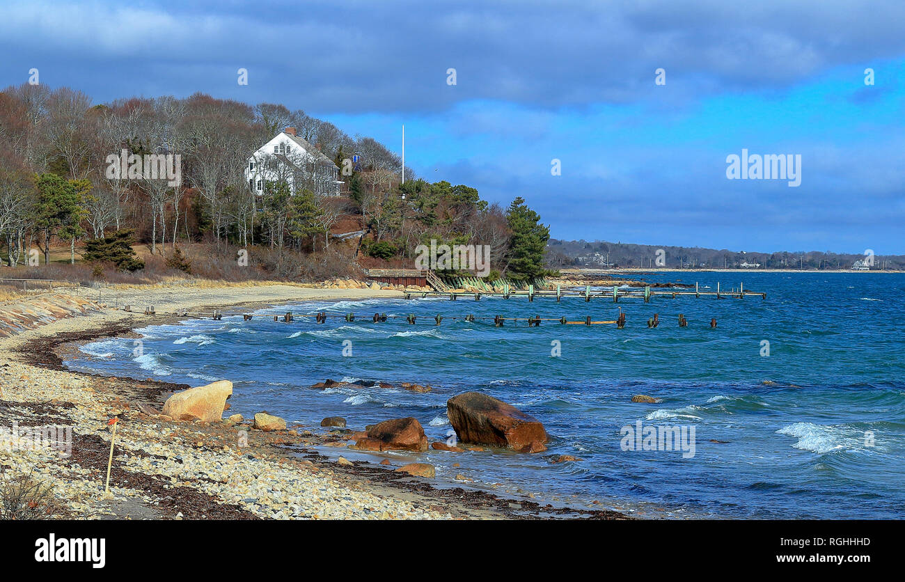Sand Beach and a distance house in Cape Cod near Falmouth, Massachusetts in sunny winter day Stock Photo