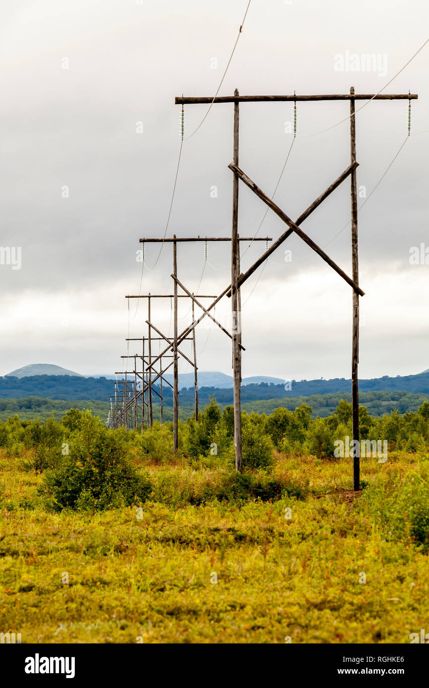 Wooden power lines in the Kamchatka mountains. Russia, Kamchatka ...
