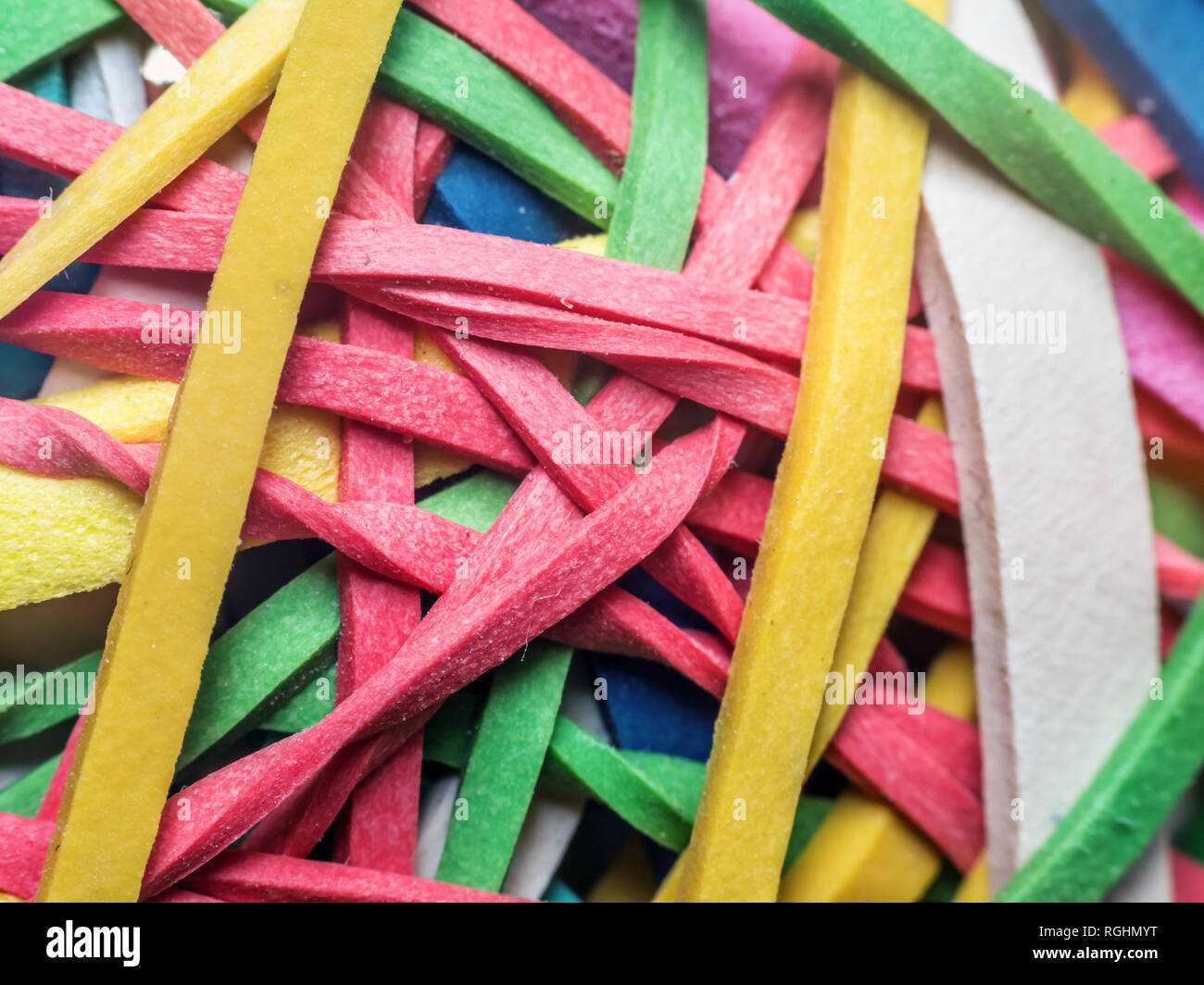 Closeup of tangled colorful rubber bands Stock Photo