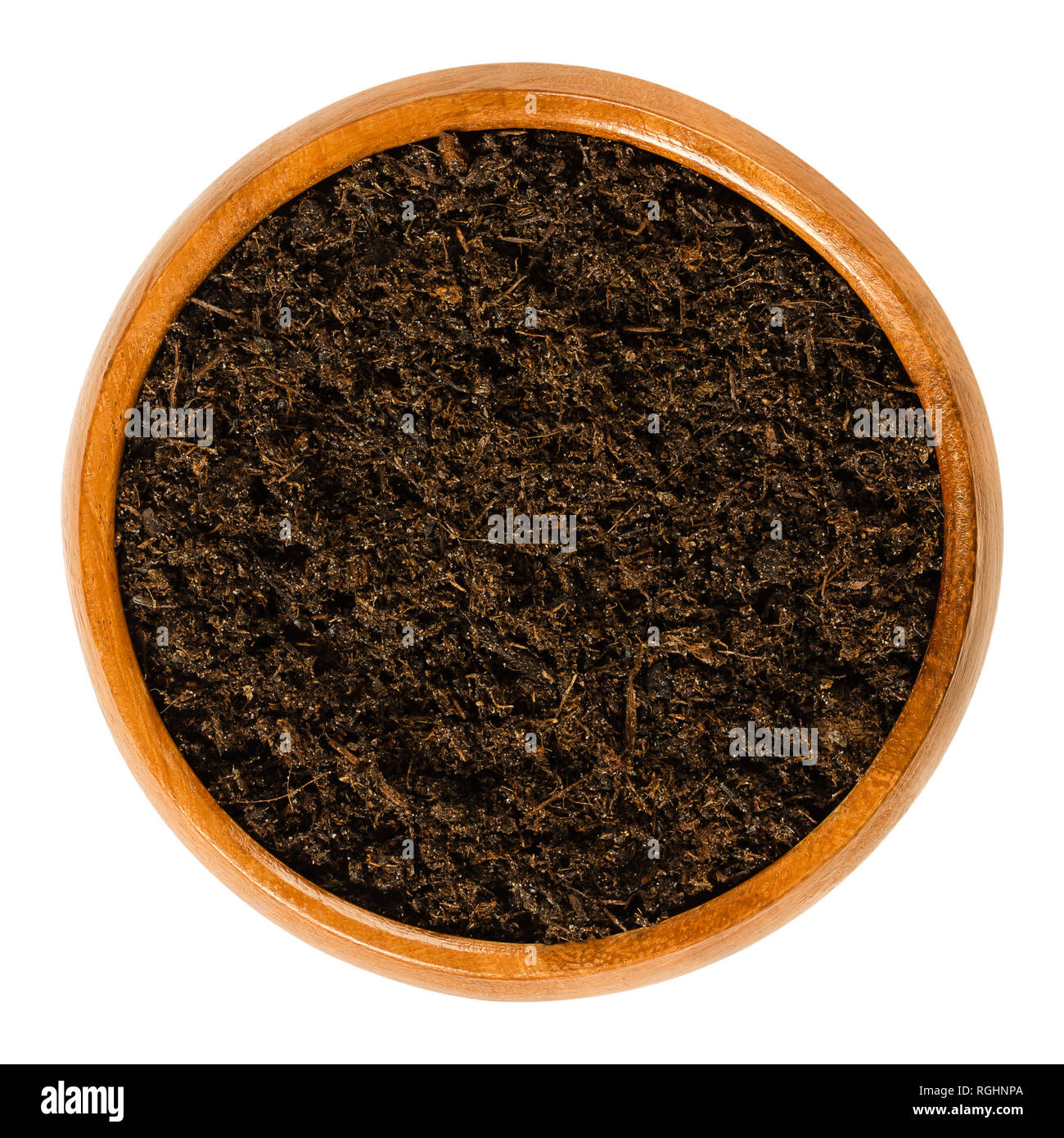 Potting soil with peat in wooden bowl. Potting mix or compost with most common ingredients turf, bark, sand and perlite. Stock Photo