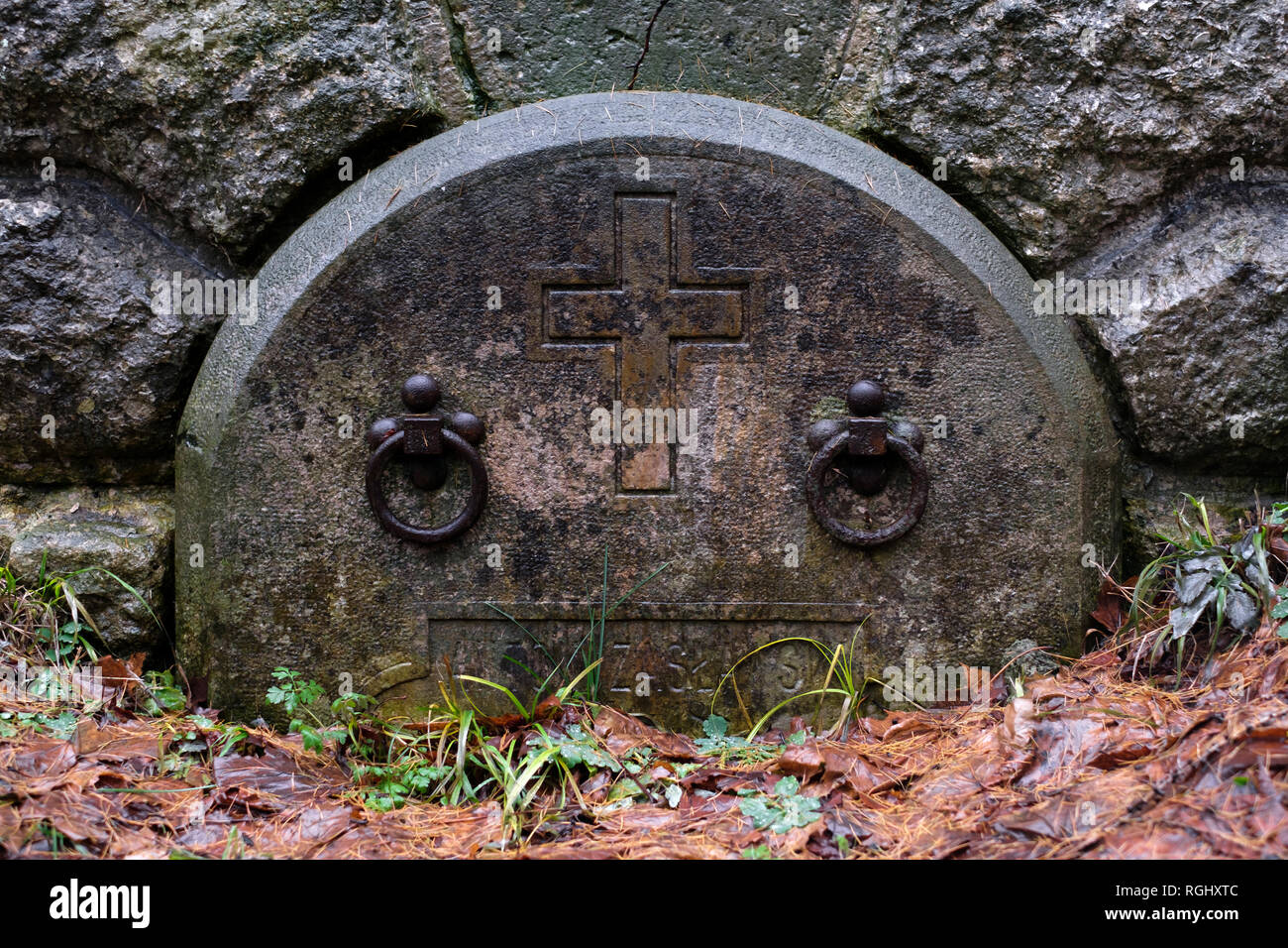 Gothic gravestone on autumn cemetery close up. Death concept Stock Photo