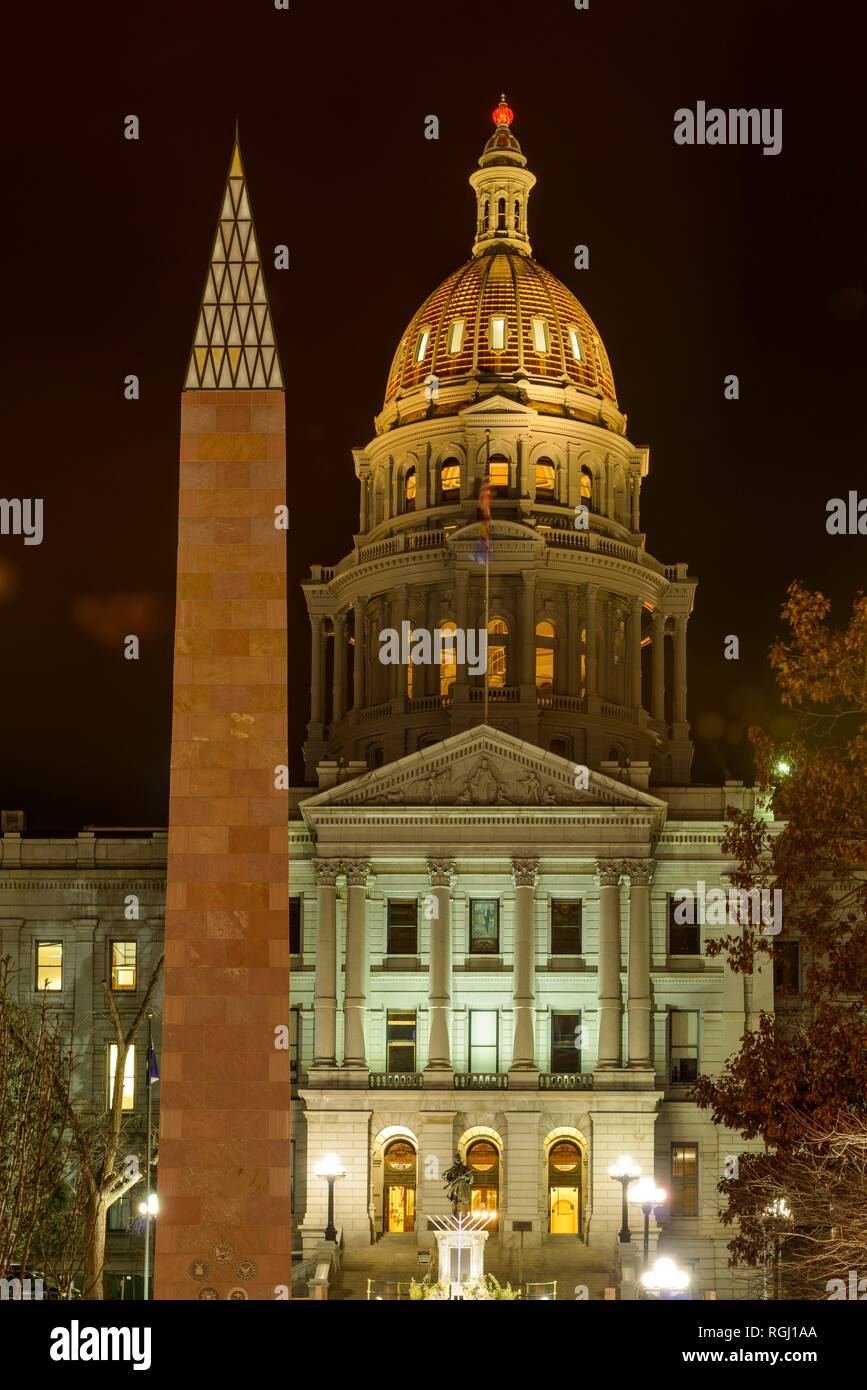Gold Dome and War Memorial - Vertical night view of golden dome of Colorado State Capitol building, with War Memorial at its side. Denver, Colorado. Stock Photo