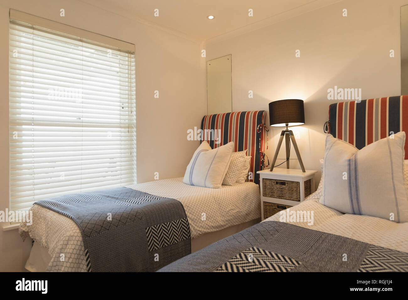 Luxury bedroom with blankets and pillows Stock Photo