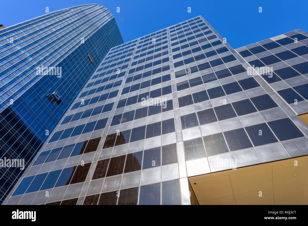Modern Skyscrapers - A wide-low-angle view of two modern steel and glass towers, Mark West Tower and 1144 Fifteenth, in Downtown Denver, Colorado, USA. Stock Photo