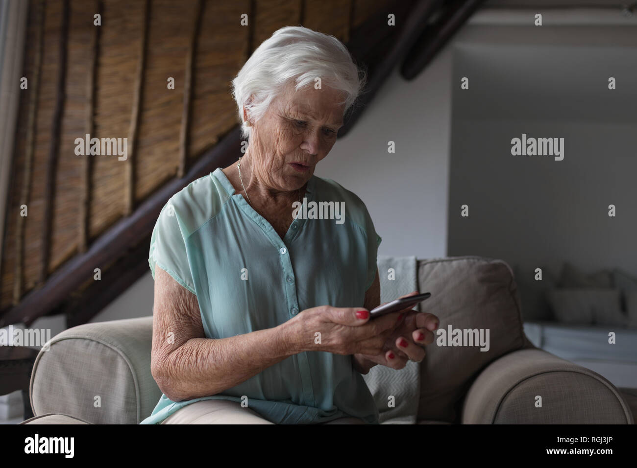 Senior woman using mobile phone Stock Photo
