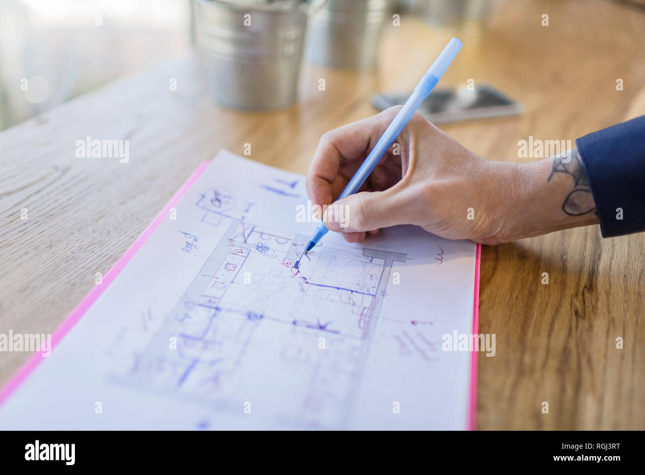 Close-up of architect working on construction plan Stock Photo