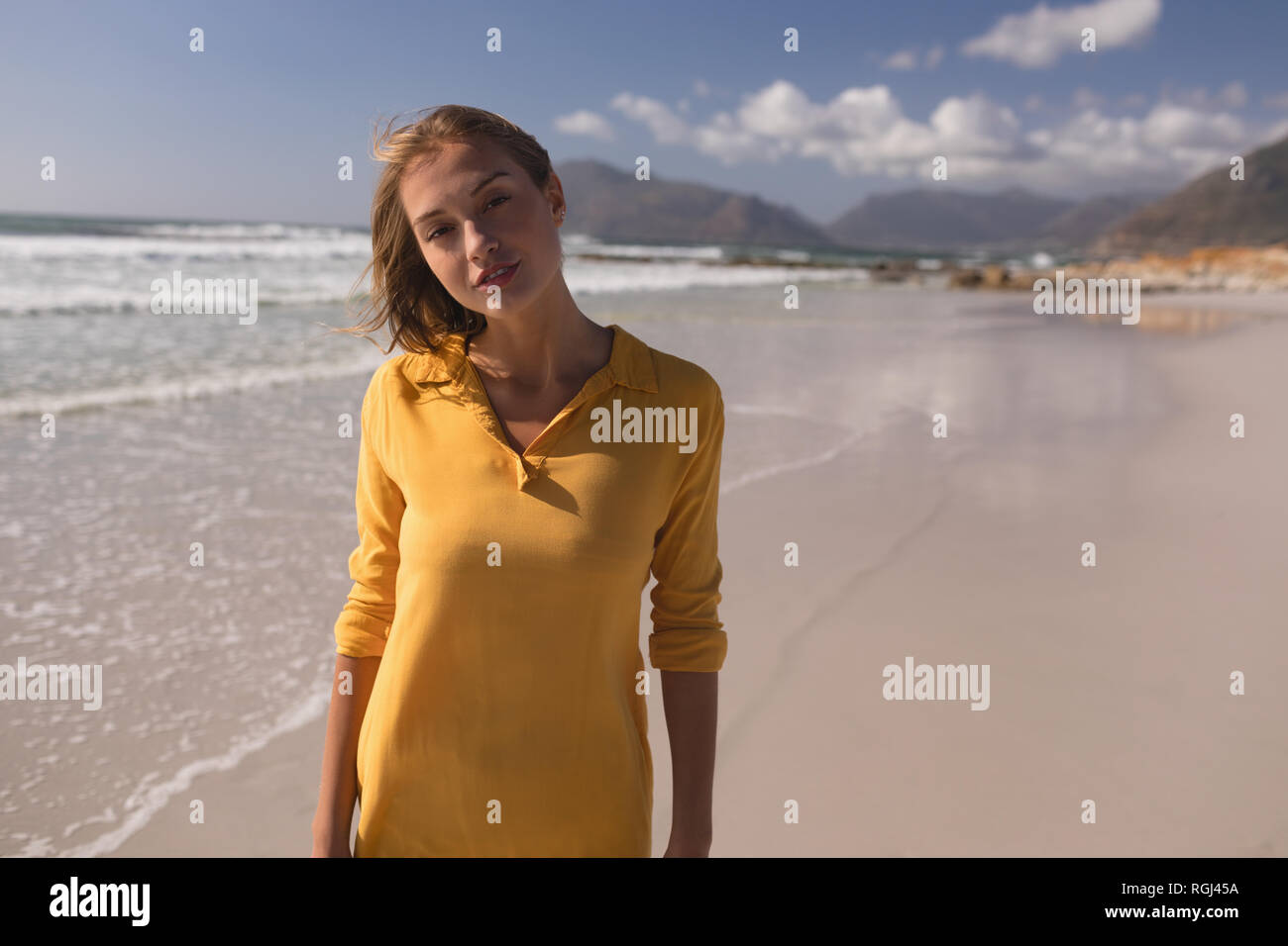 Young woman walking alone beach hi-res stock photography and images - Alamy