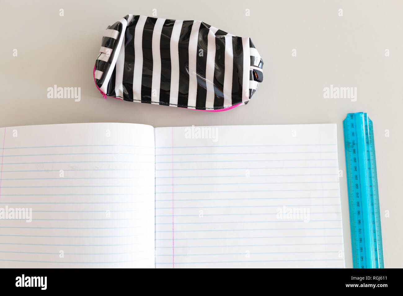 Notebook, ruler and pencil case on the desk in school Stock Photo