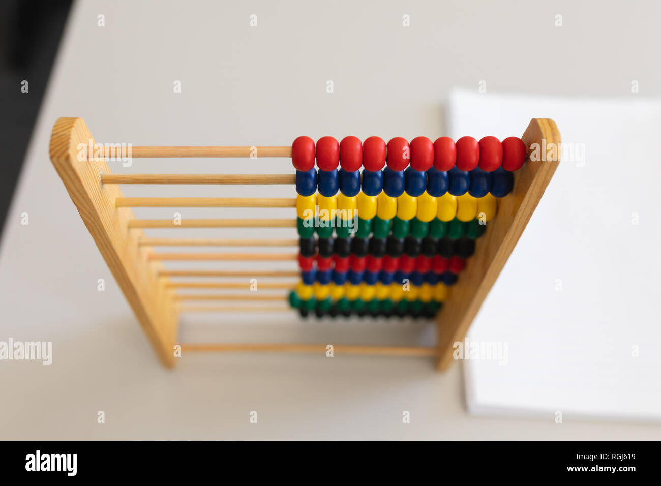 Abacus and bunch of paper on the desk in school Stock Photo