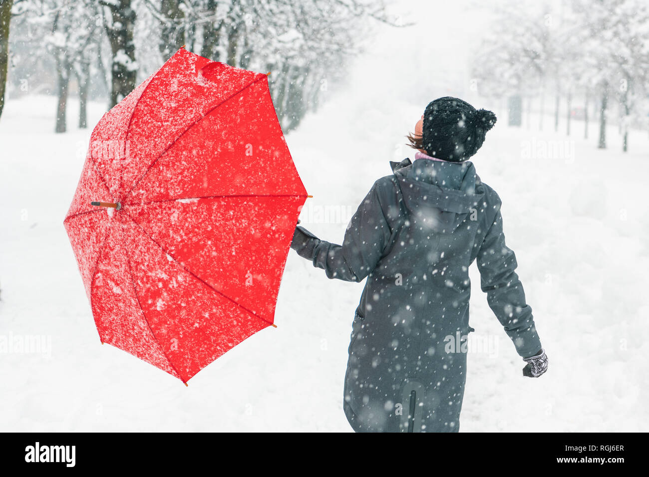 Red umbrella winter snow hires stock photography and images Alamy