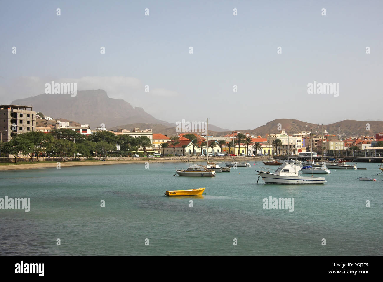 Harbor with fishing boats & the water front of Mindelo on Sao Vicente Island, Cape Verde Islands. Stock Photo