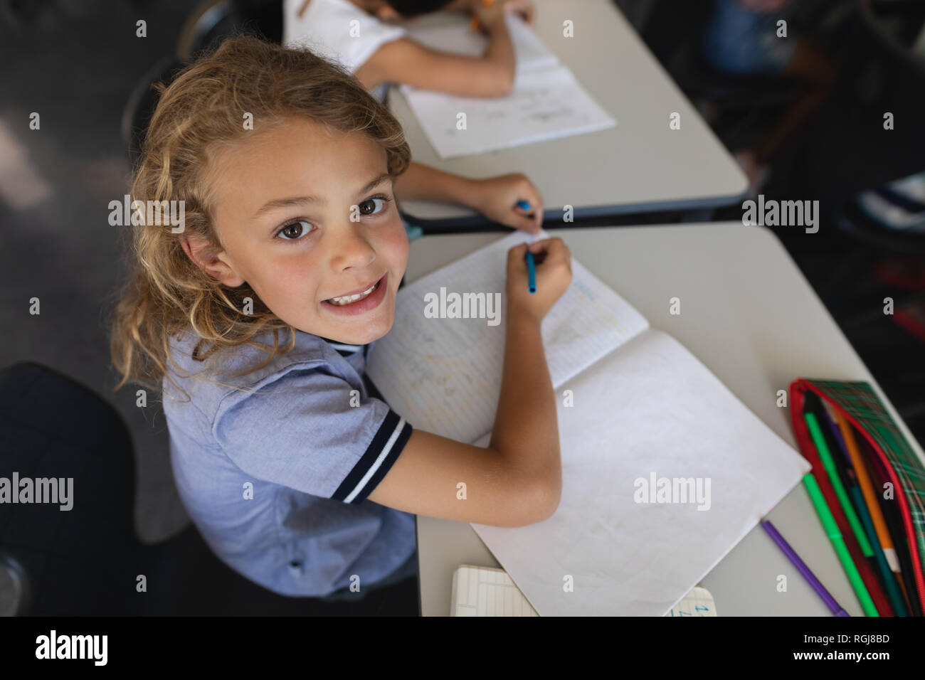 Smiling high school girl pencil hi-res stock photography and images - Alamy