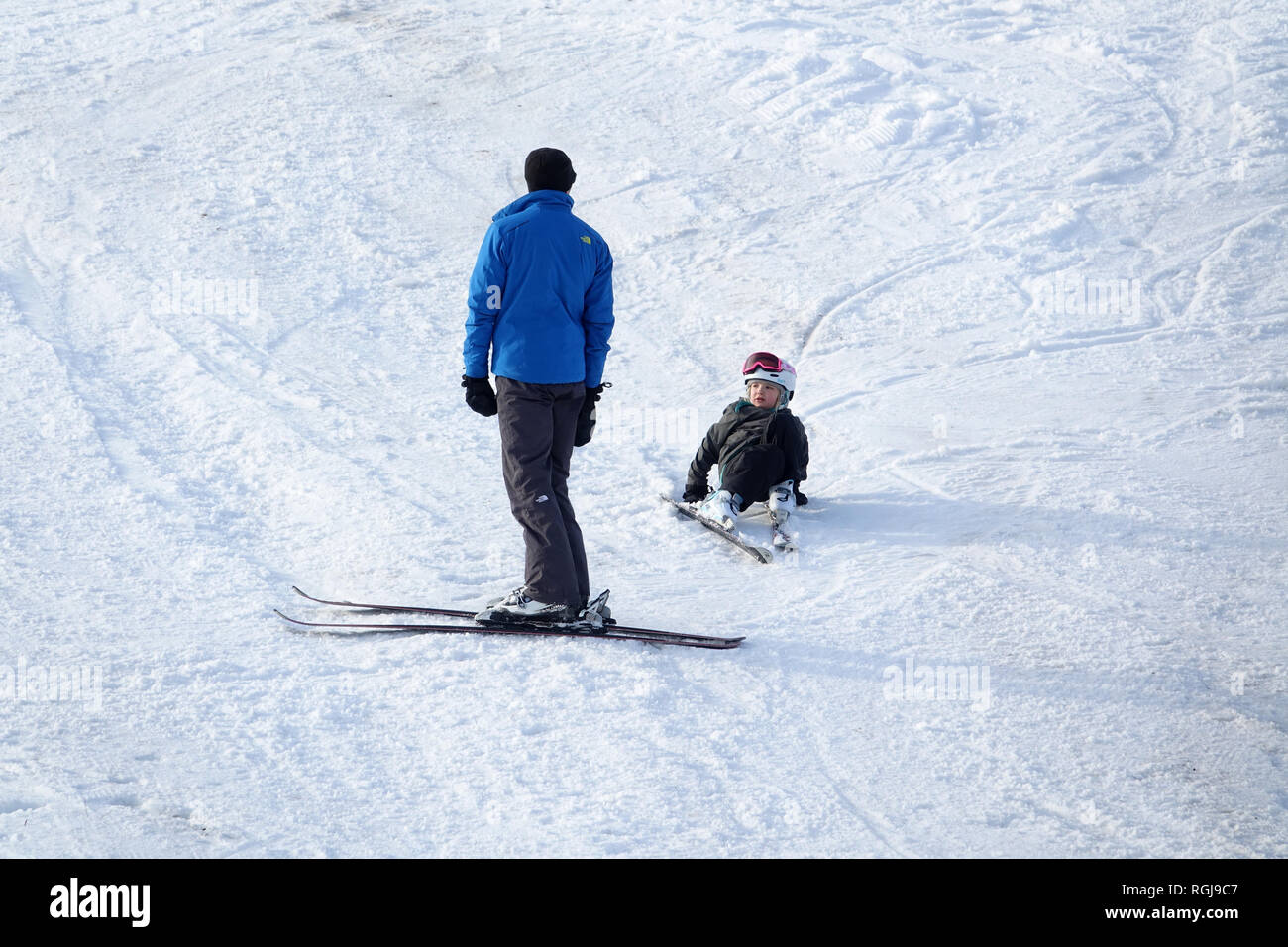 A young skier is coached by an instructor at the Echo Valley Ski Area in the Lake Chelan Valley. Stock Photo