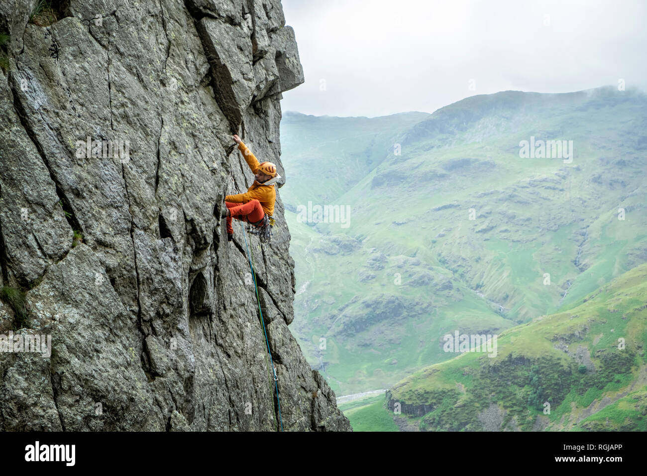 United Kingdom, Lake District, Langdale Valley, Gimmer Crag, climber on rock face Stock Photo