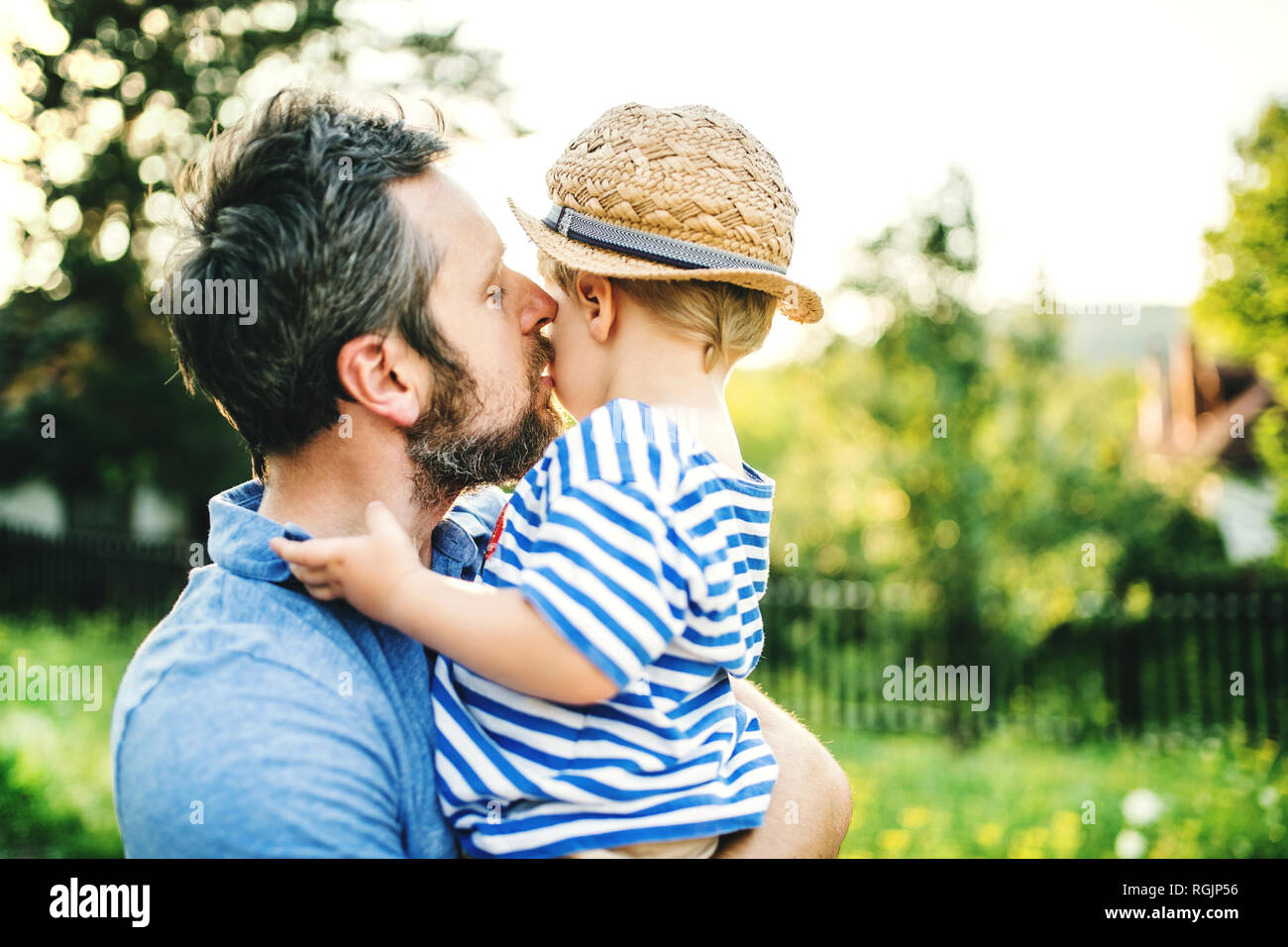 Father kissing his little son Stock Photo