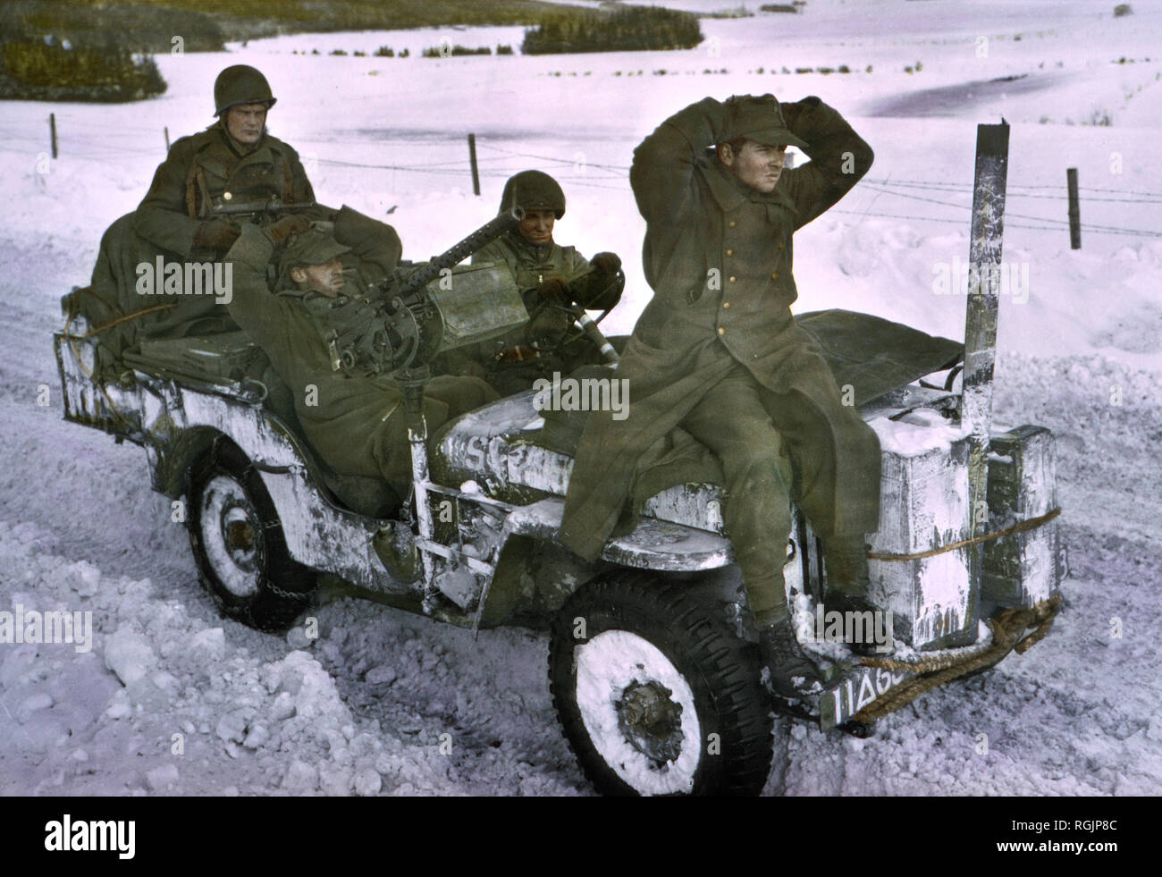Two German Prisoners Being Brought in, Ardennes-Alsace Campaign, Battle of the Bulge, 1945 Stock Photo
