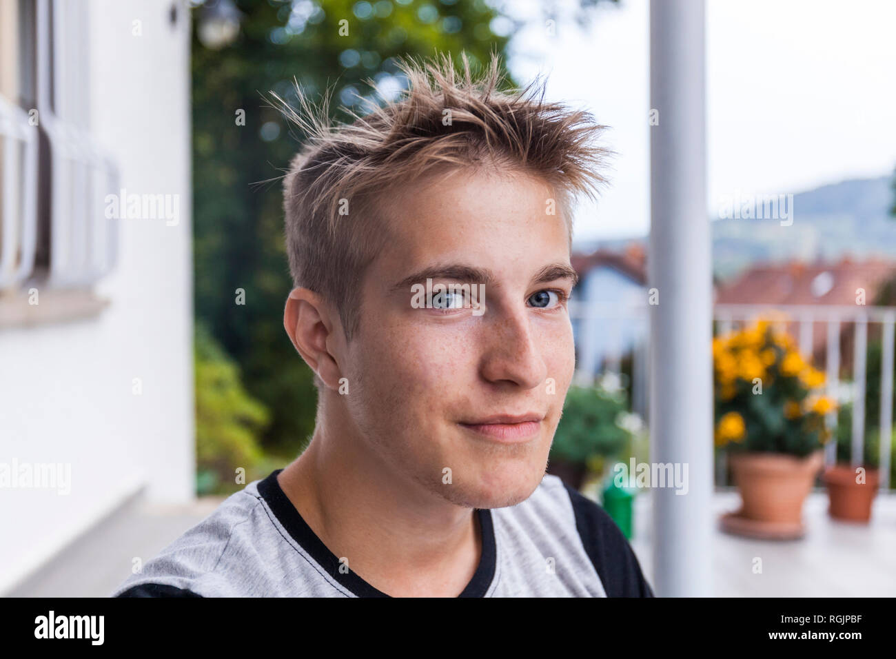 Portrait of smiling, blond man, looking confident Stock Photo