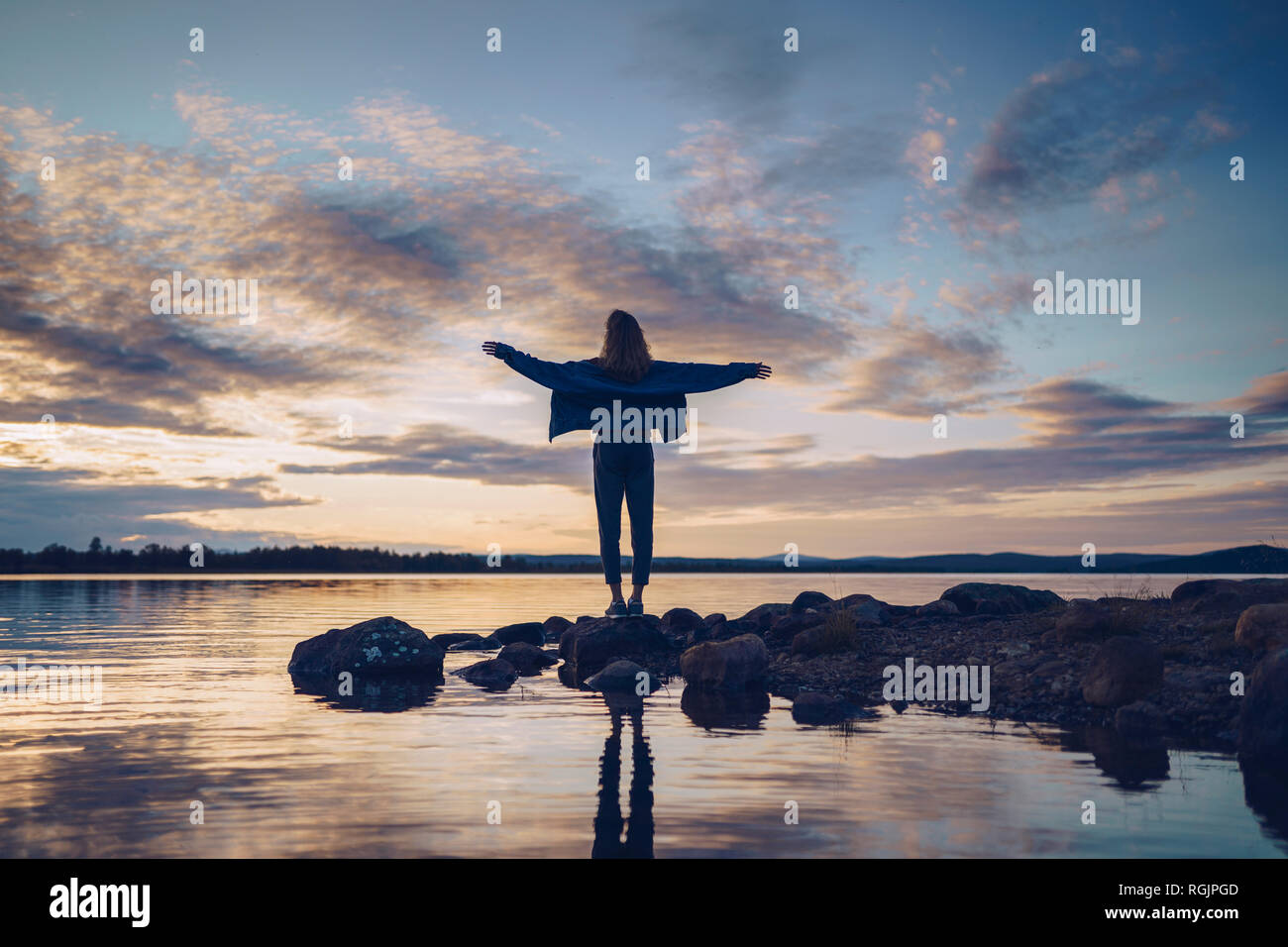 Young woman standing arms wide hi-res stock photography and images - Alamy