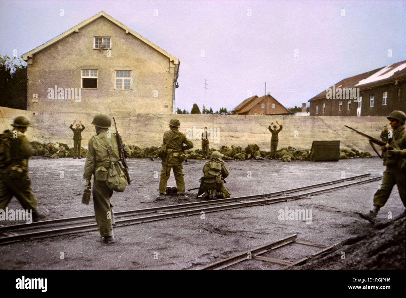Capturing SS Guards in Coal Yard at Concentration Camp by 42nd Infantry Division, U.S. Seventh Army, Dachau, Germany, Central Europe Campaign, Western Allied Invasion of Germany, April 1945 Stock Photo