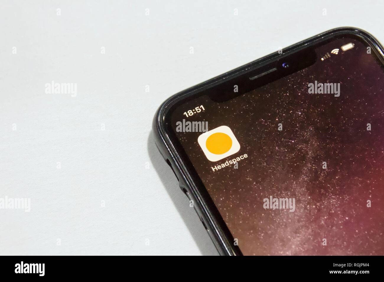 Headspace app, a meditation app, on an iPhone X on a white background