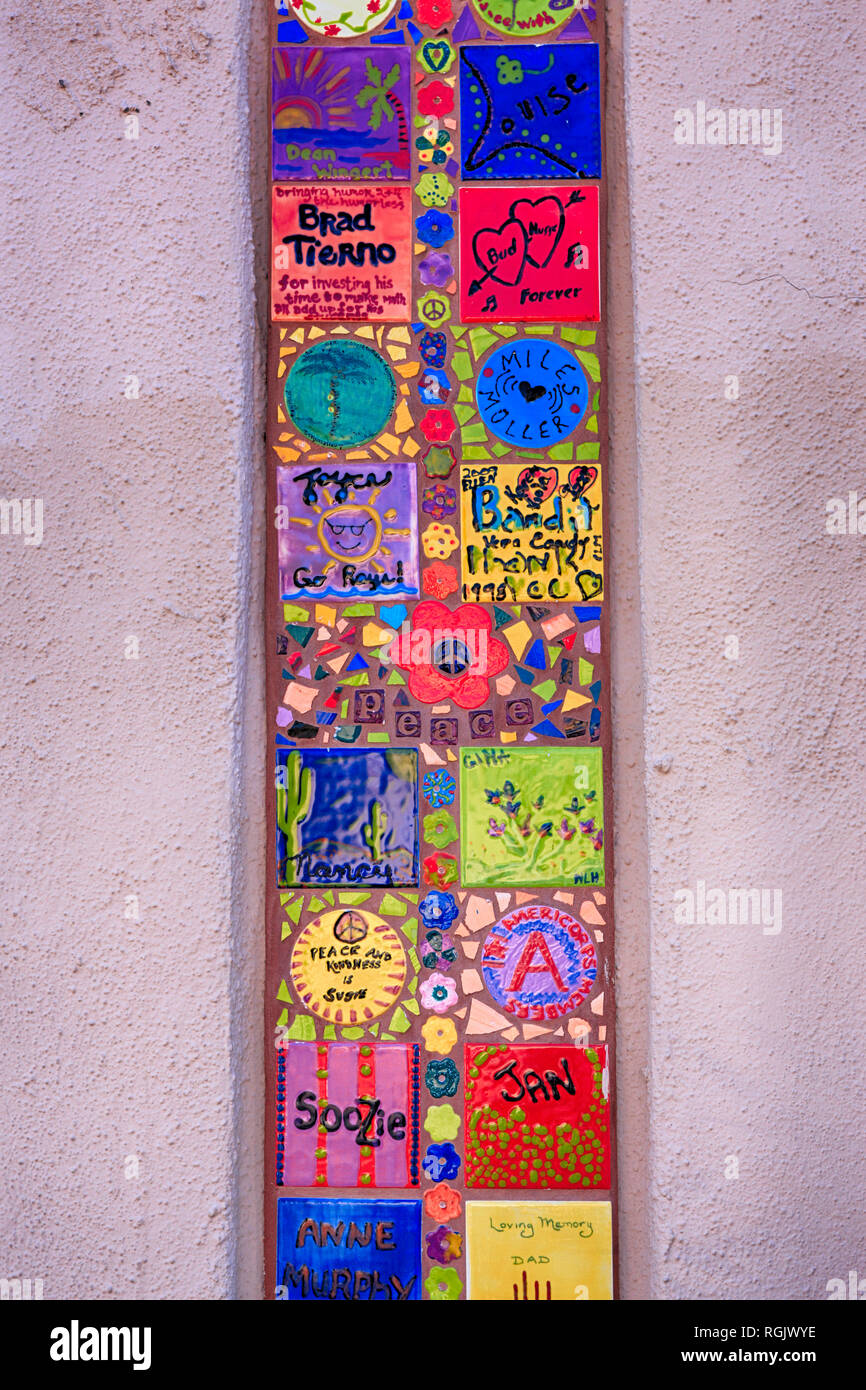 Small ceramic tiles created by past UA students on a column leading to a shopping courtyard on University/Tyndall in Tucson AZ Stock Photo
