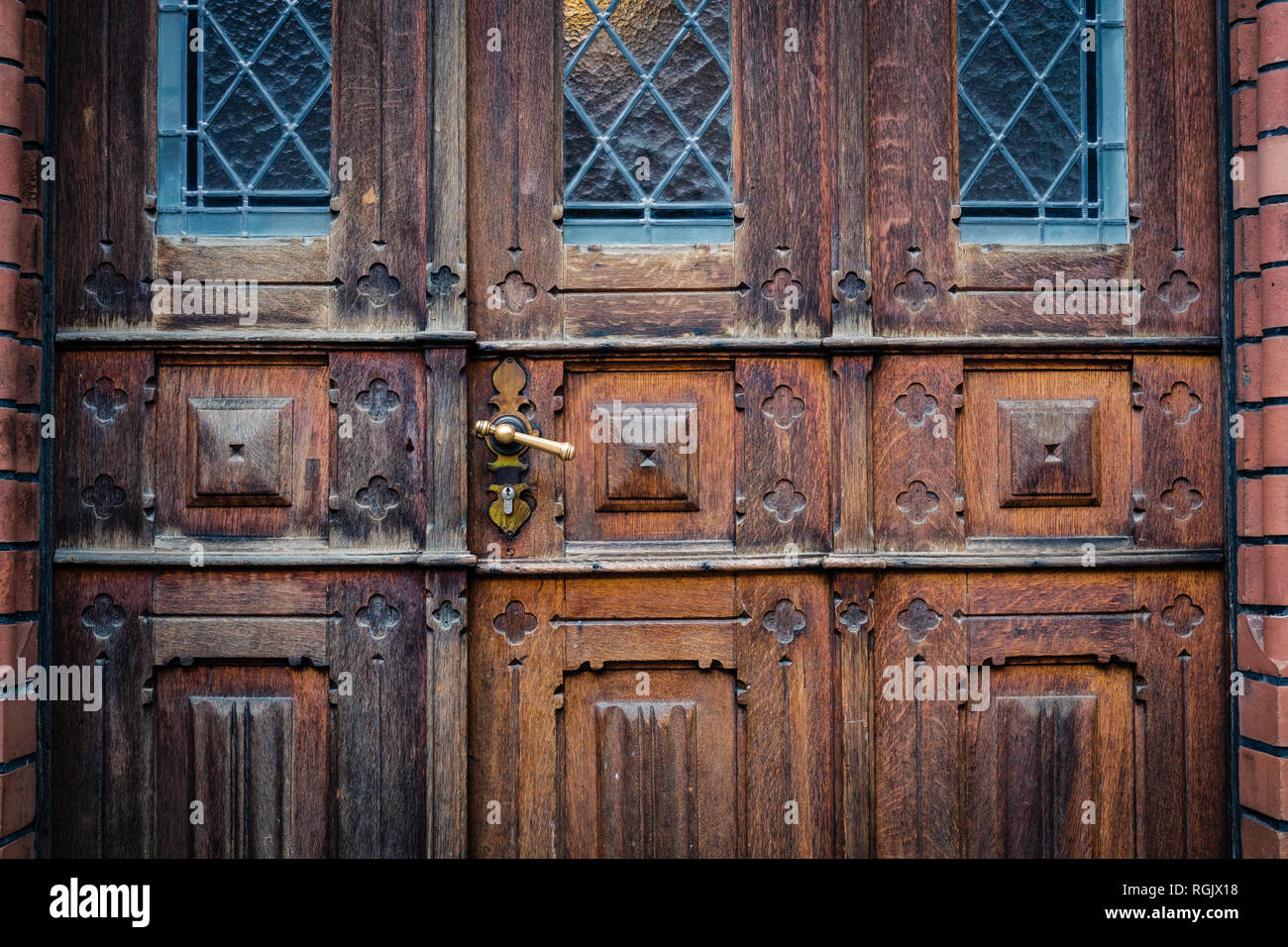 closeup of old wooden door with metal handle Stock Photo