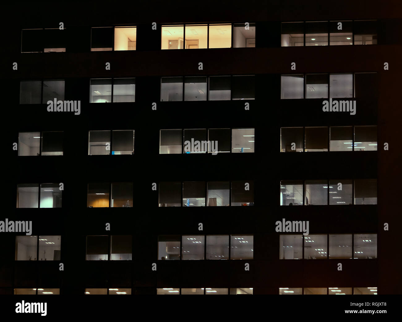 Frontal view of the night facade of building with a many windows Stock ...