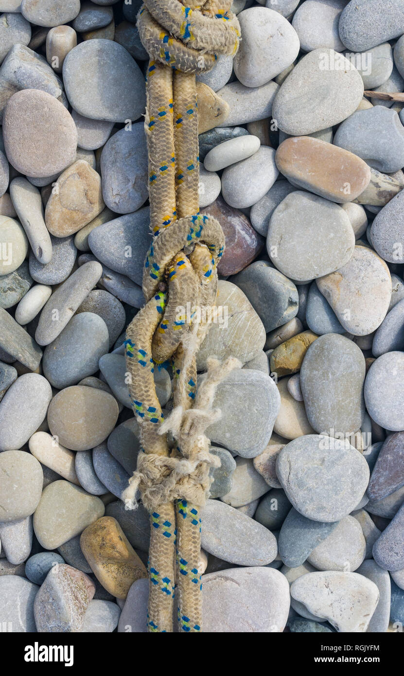 High Rope Pebble Bridge Battered boats on beach hi-res stock photography and images - Alamy