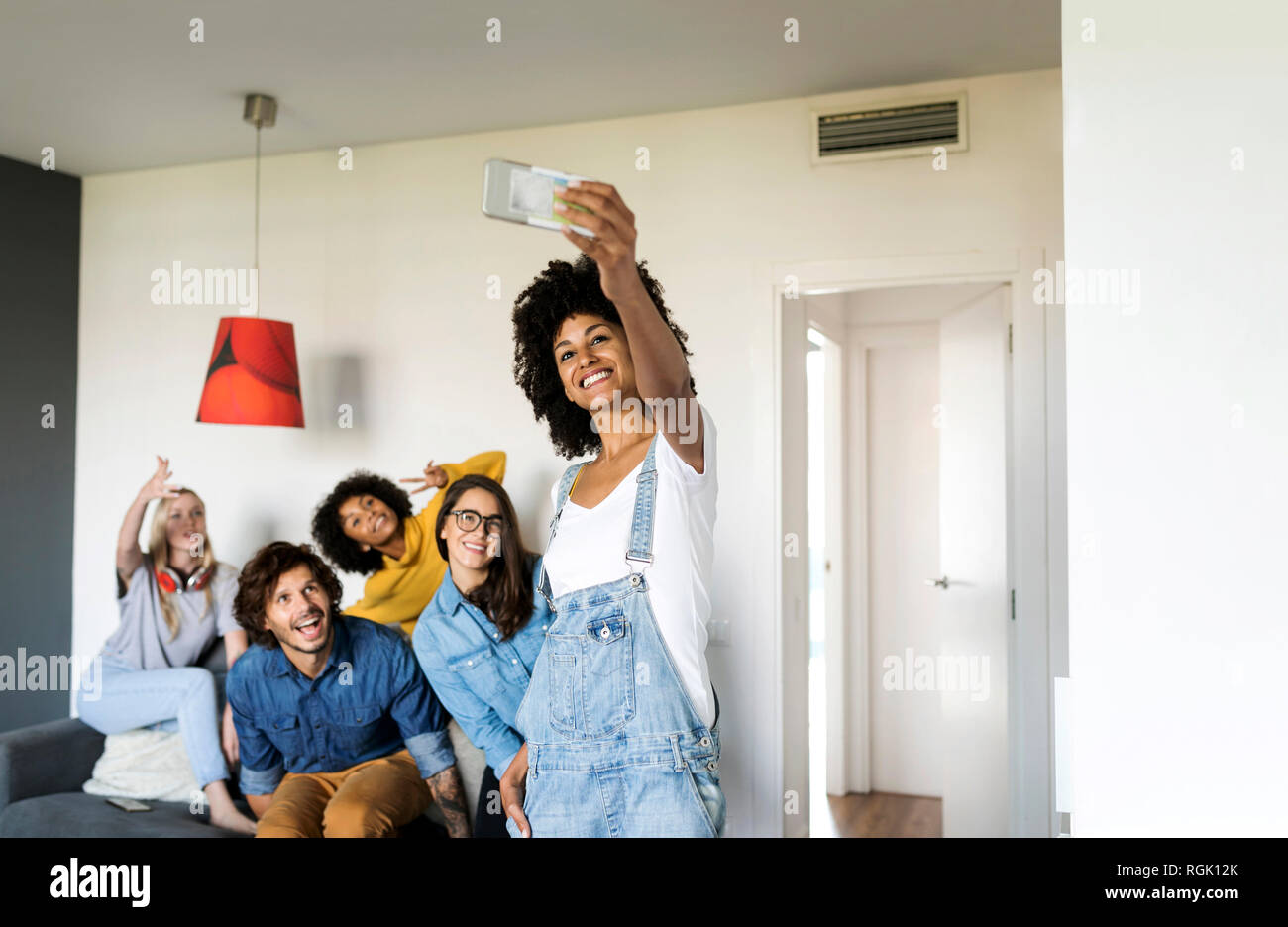 Cheerful friends taking a selfie at home Stock Photo