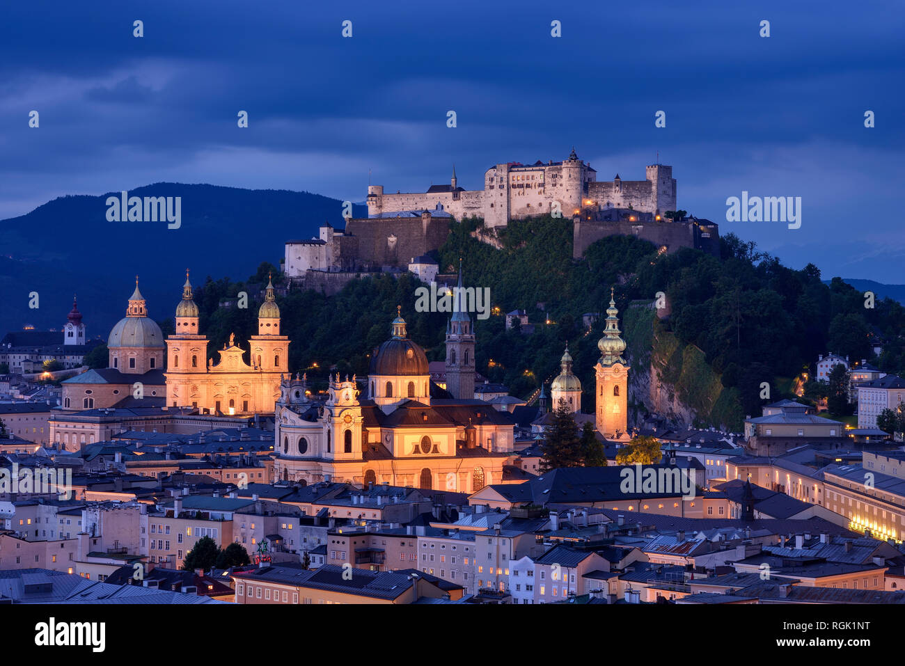 Austria, Salzburg, Monchsberg with Hohensalzburg fortess at dusk Stock Photo