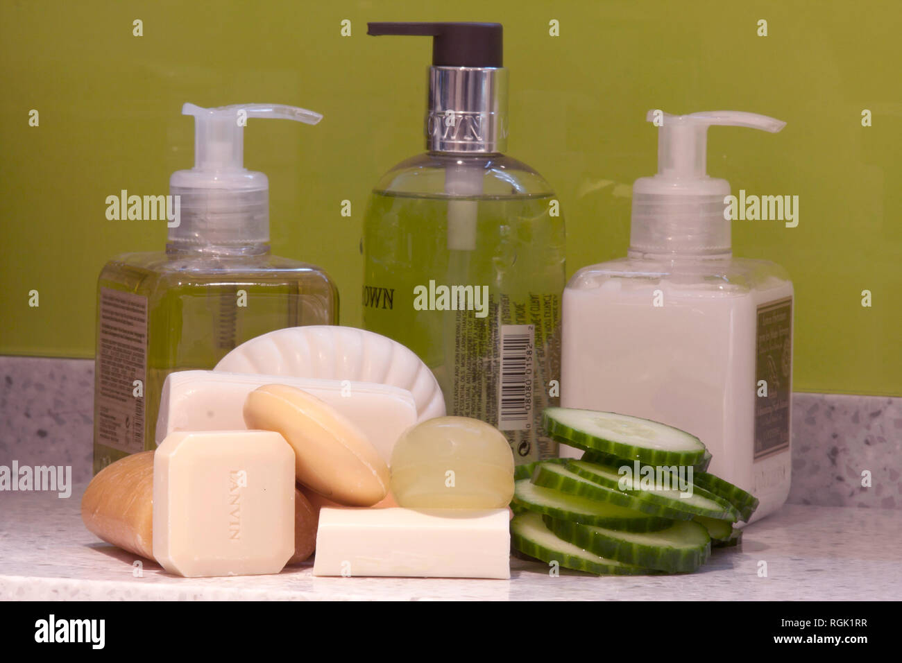 variety of natural & liquid soaps with slices of cucumber Stock Photo