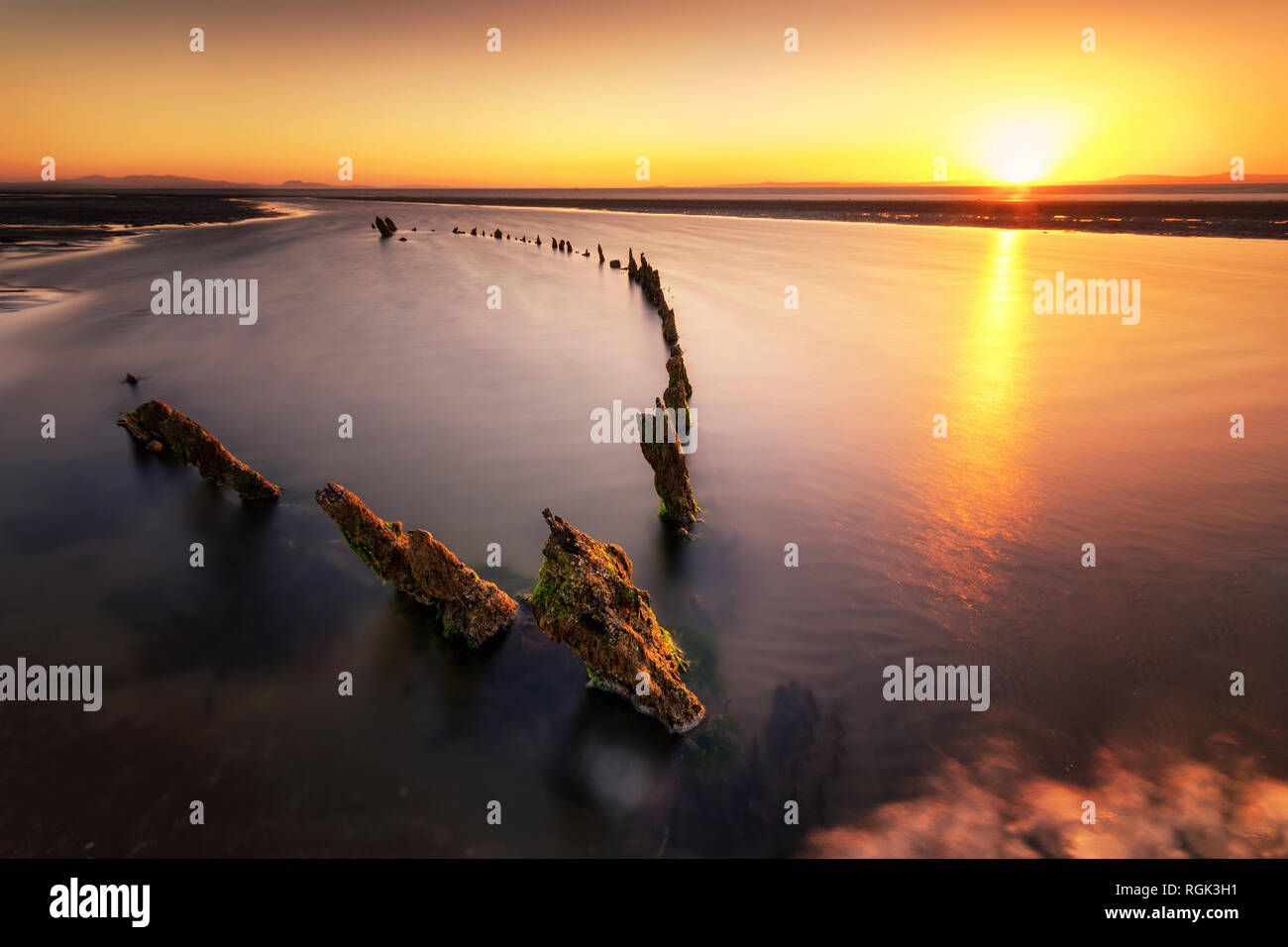 Great Britain, Scotland, East Lothian, Aberlady Nature Reserve, Shipwreck at sunset Stock Photo