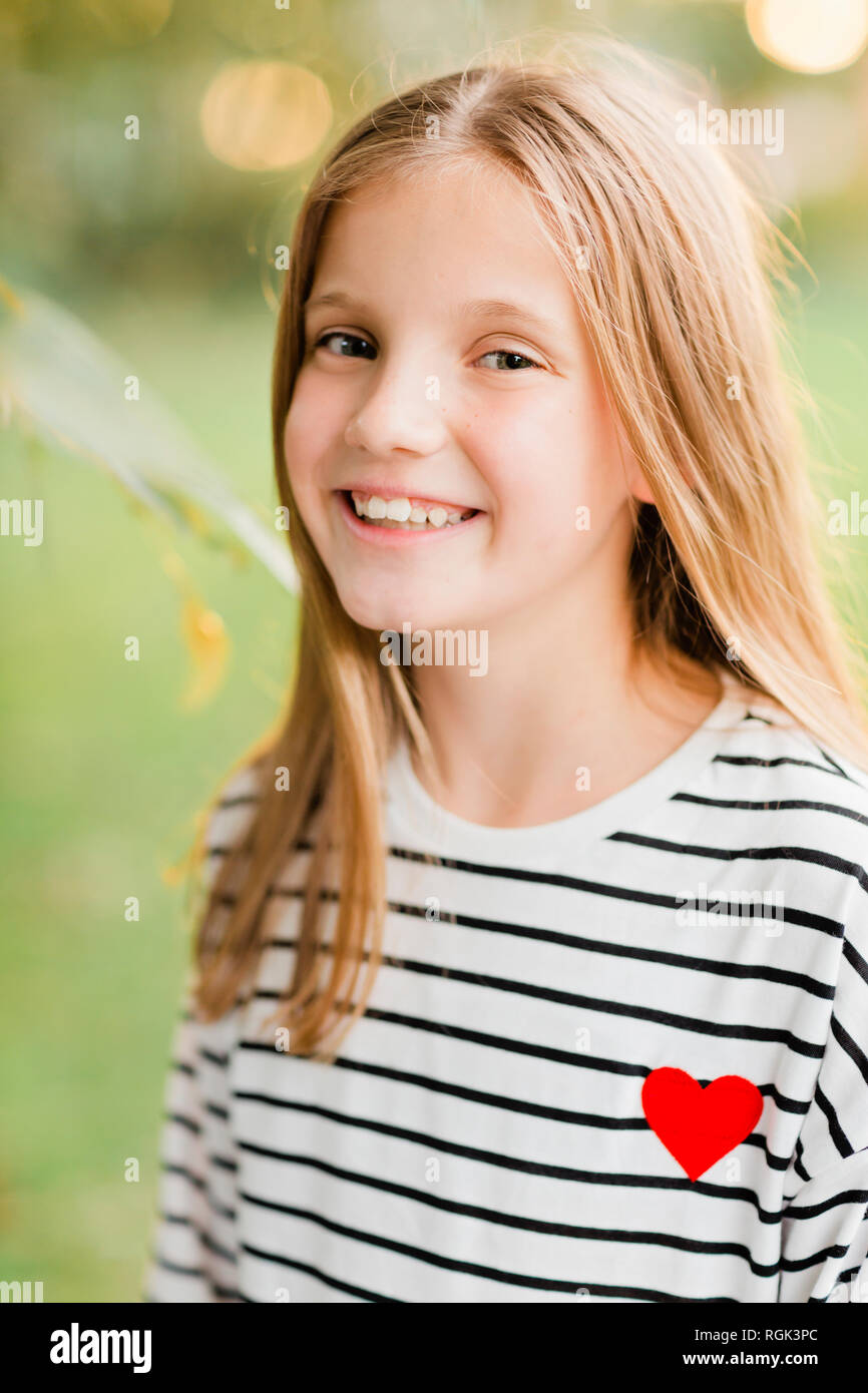 Portrait of smiling blond girl Stock Photo - Alamy