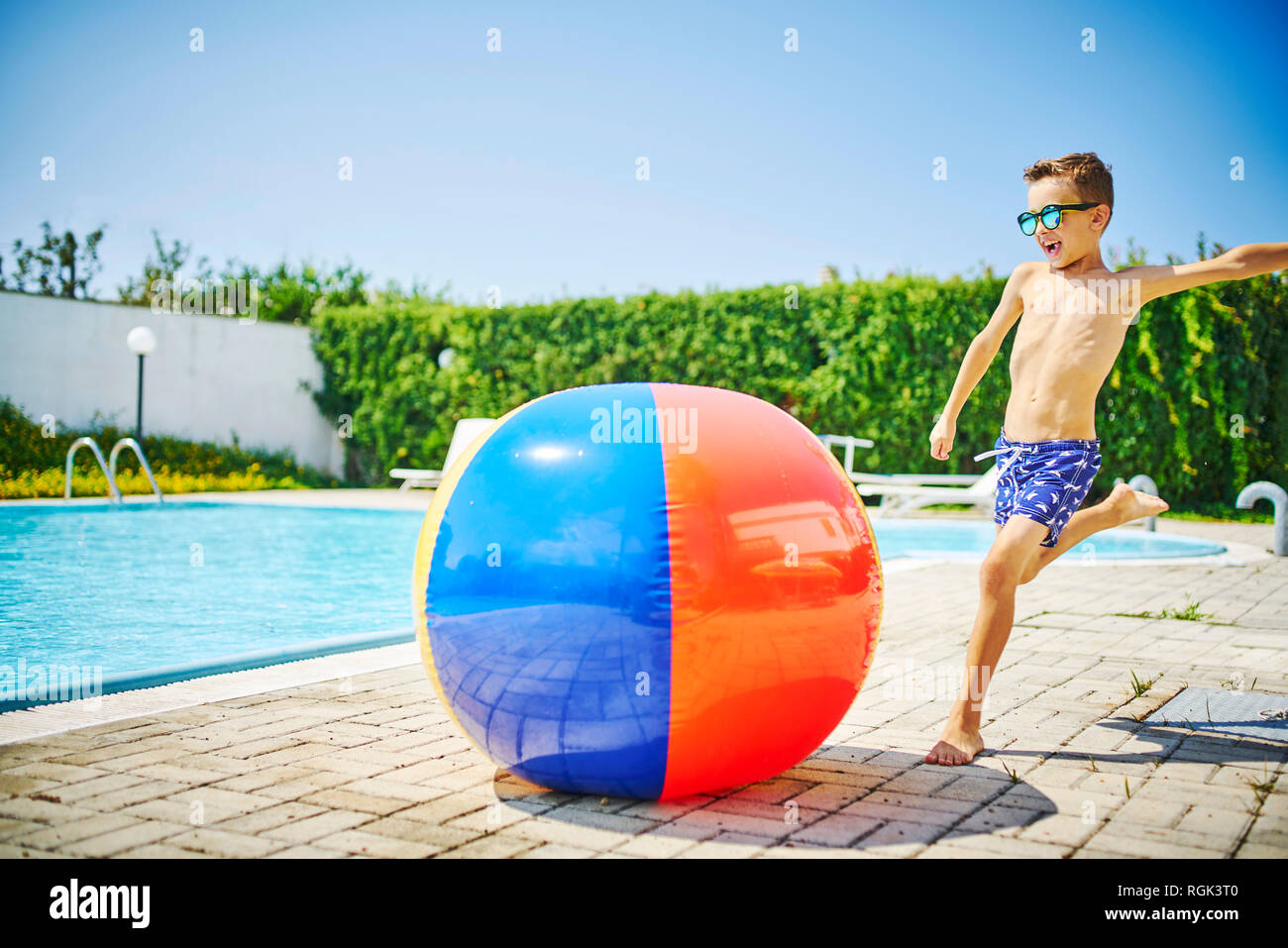 Boy kicking beach ball hires stock photography and images Alamy