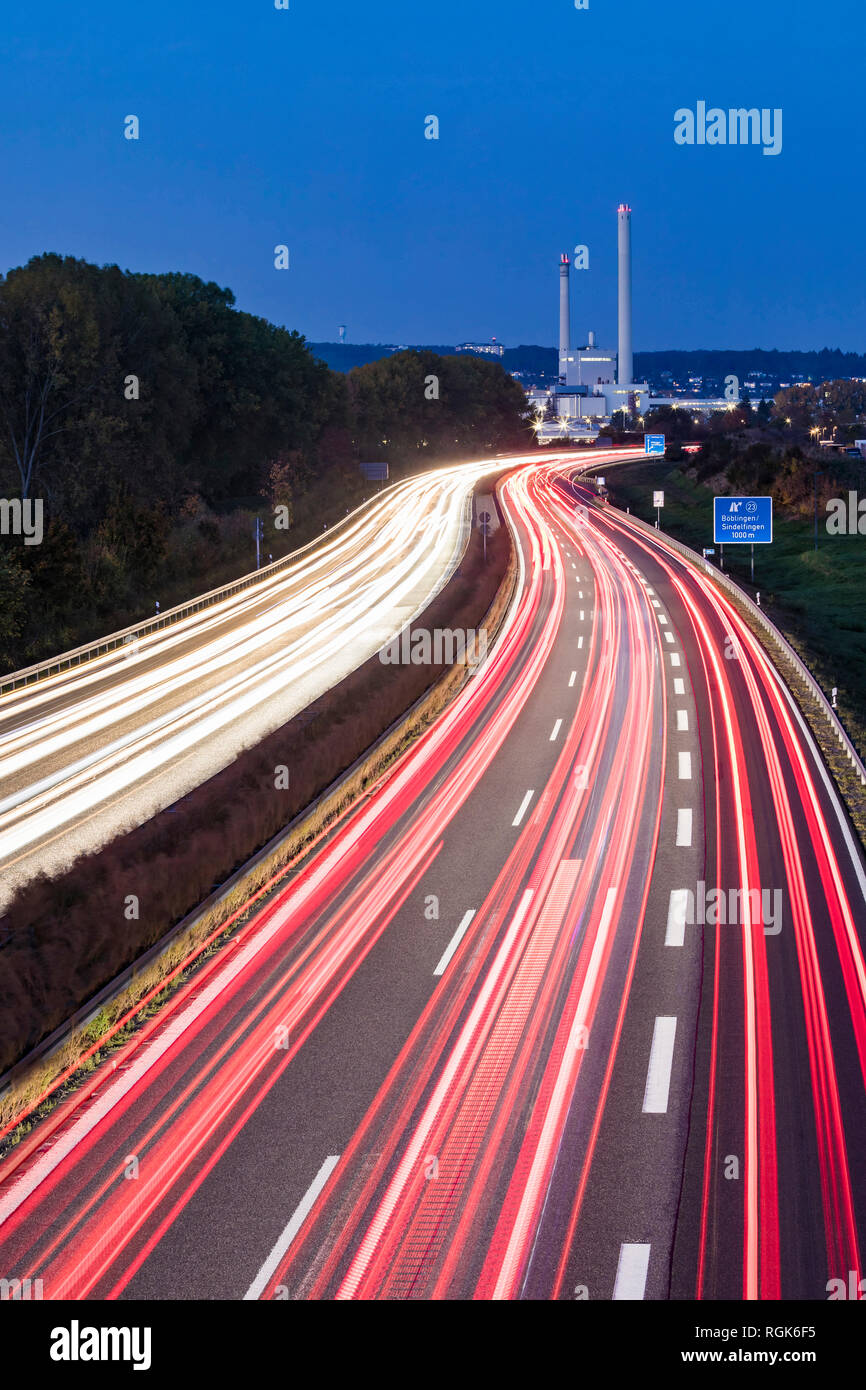 Germany, Baden-Wuerttemberg, Boeblingen, Sindelfingen, A 81 and cogeneration plant at blue hour Stock Photo