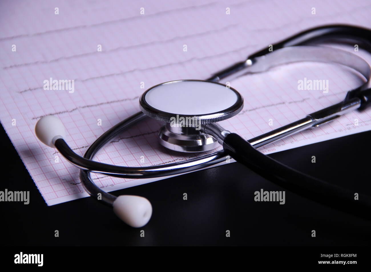 Electrocardiogram results and stethoscope Stock Photo