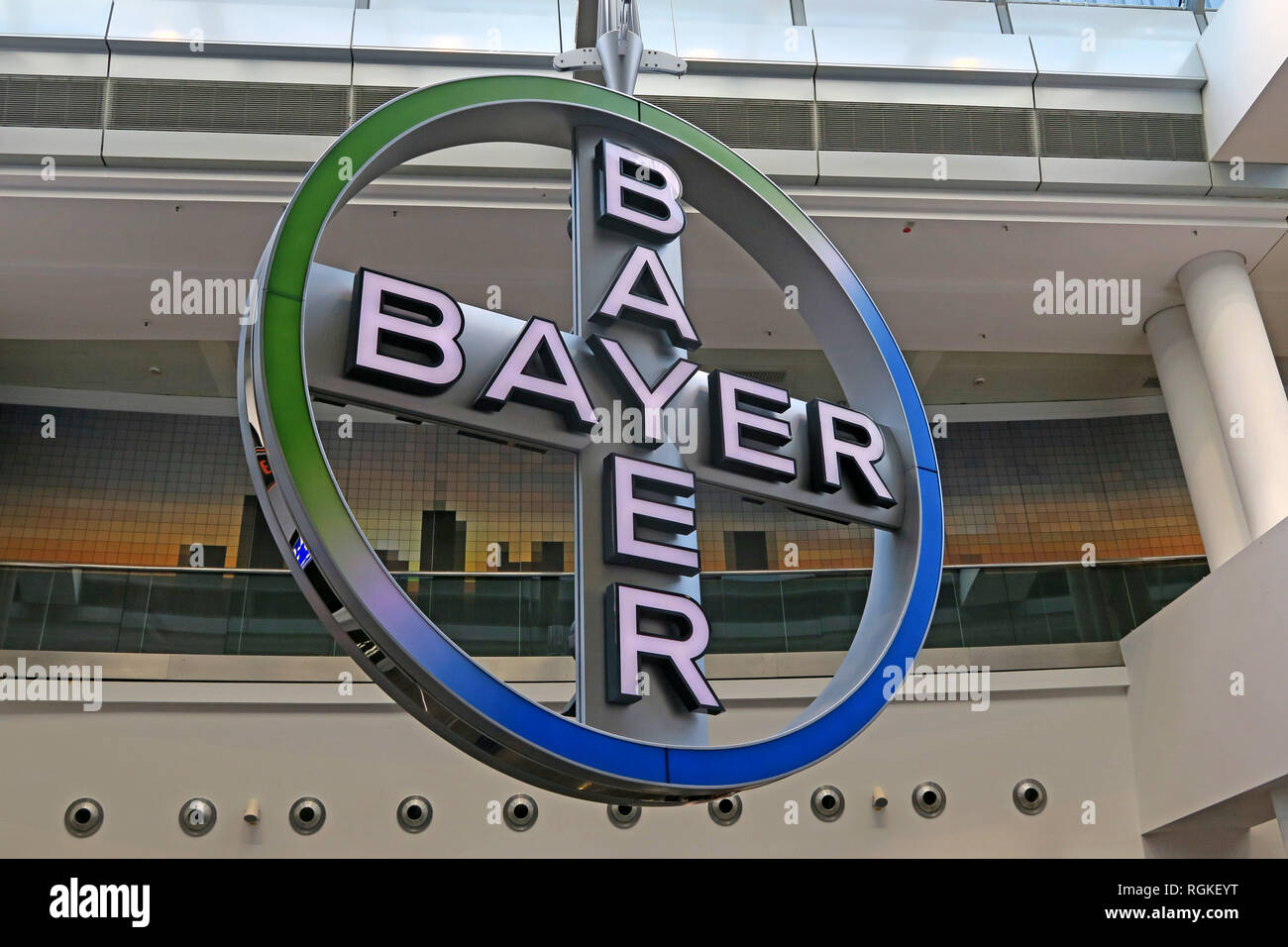 Bayer AG Cross Logo, rotating in Frankfurt Airport, Rhineland, Germany, Europe Stock Photo