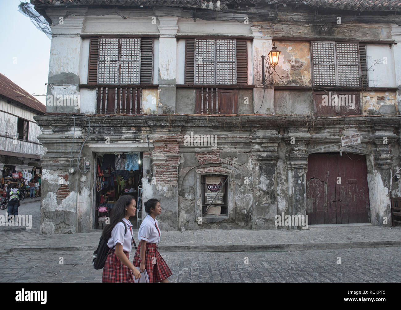 Students walking in historic Vigan, Ilocos Sur, Philippines Stock Photo