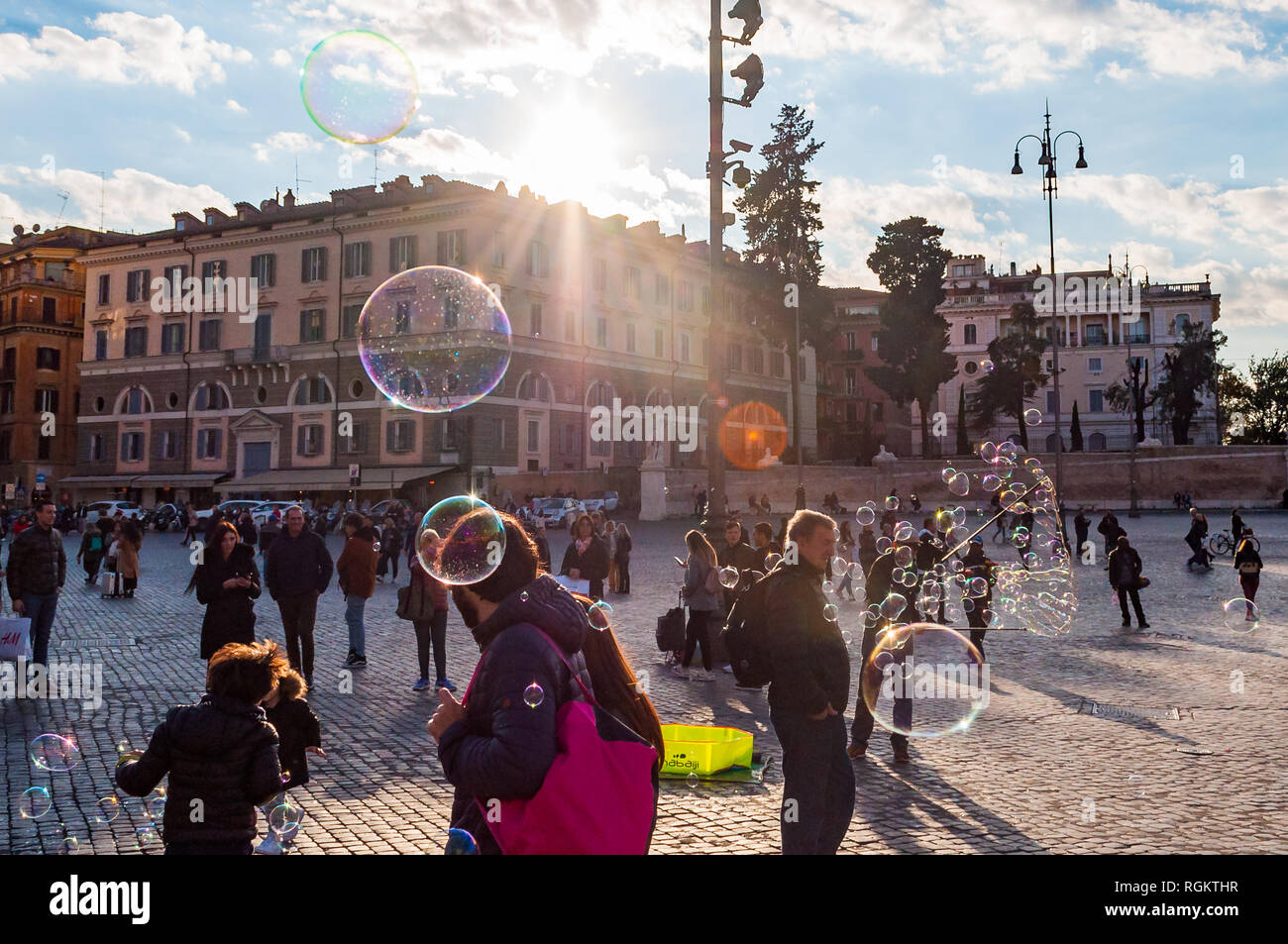 Rome, Italy - November 18, 2018: Kids catching and blowing soap bubbles ...