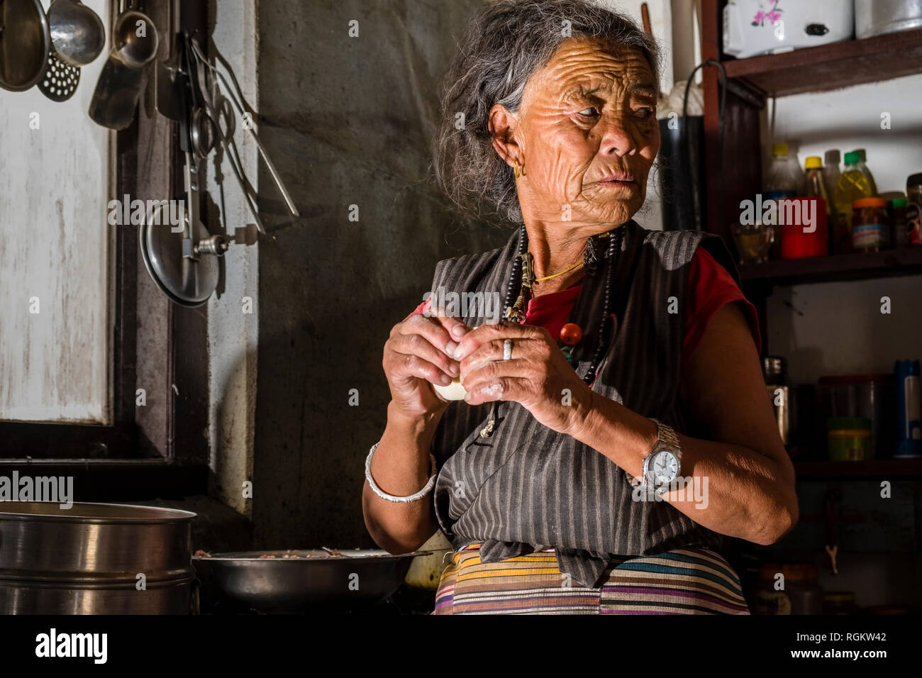 Portrait of a local woman, working in a kitchen Stock Photo