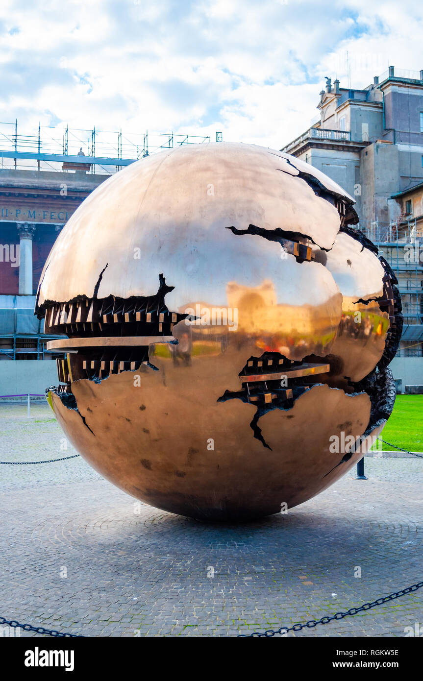 Vatican, Rome, Italy - November 16, 2018: Sphere Within Sphere Sfera con sfera is a bronze sculpture by Italian sculptor Arnaldo Pomodoro decorates a  Stock Photo