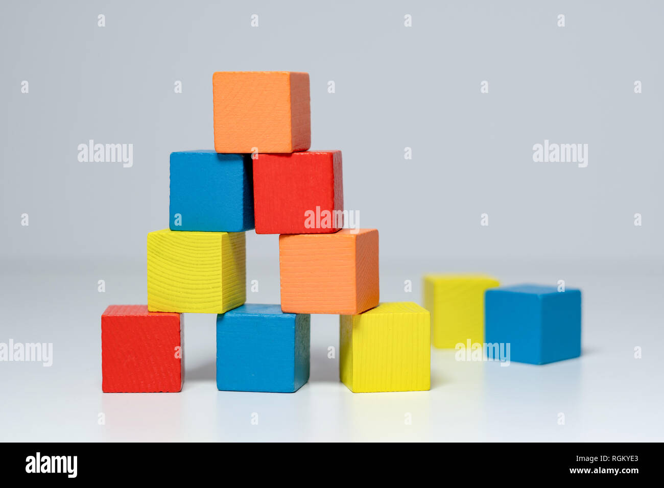 Building from wooden colourful childrens blocks Stock Photo - Alamy